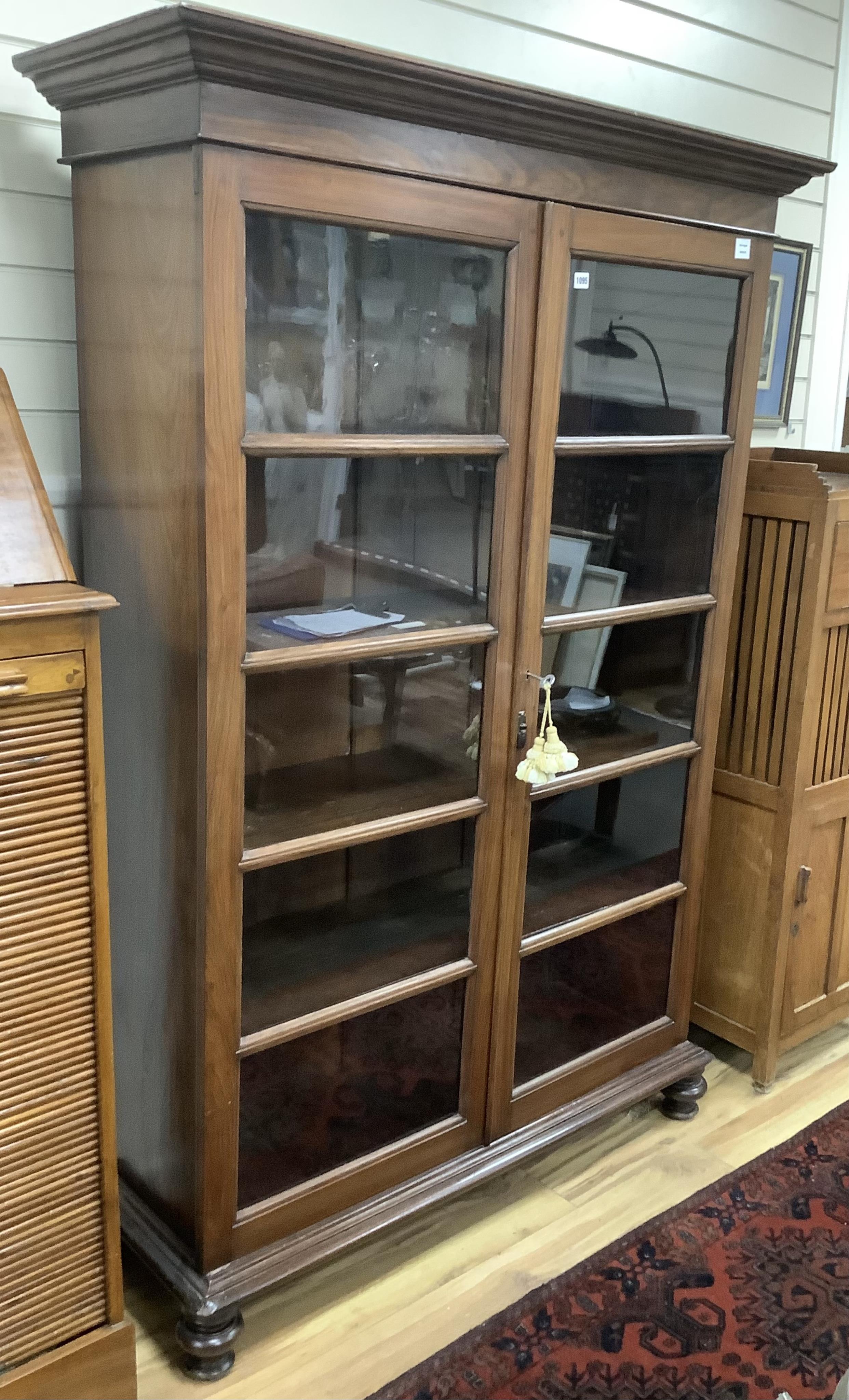 A 20th century Victorian style Anglo Indian rosewood bookcase, width 127cm, depth 44cm, height 186cm. Condition - good